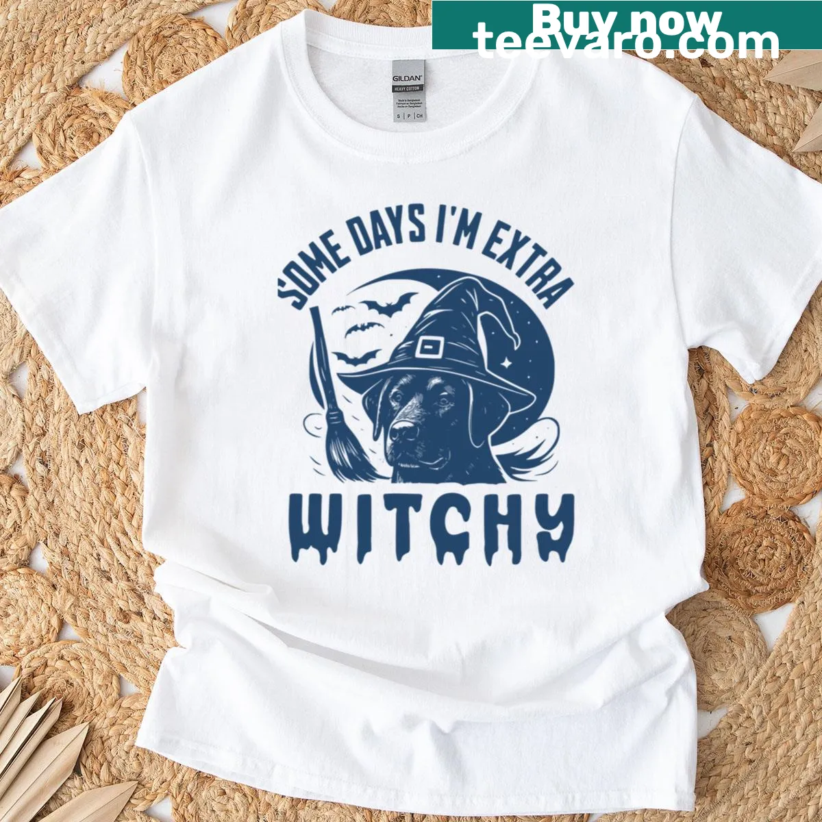 Oversized Halloween T-shirt with cartoon Black Labrador in witch attire — on a men's t-shirt