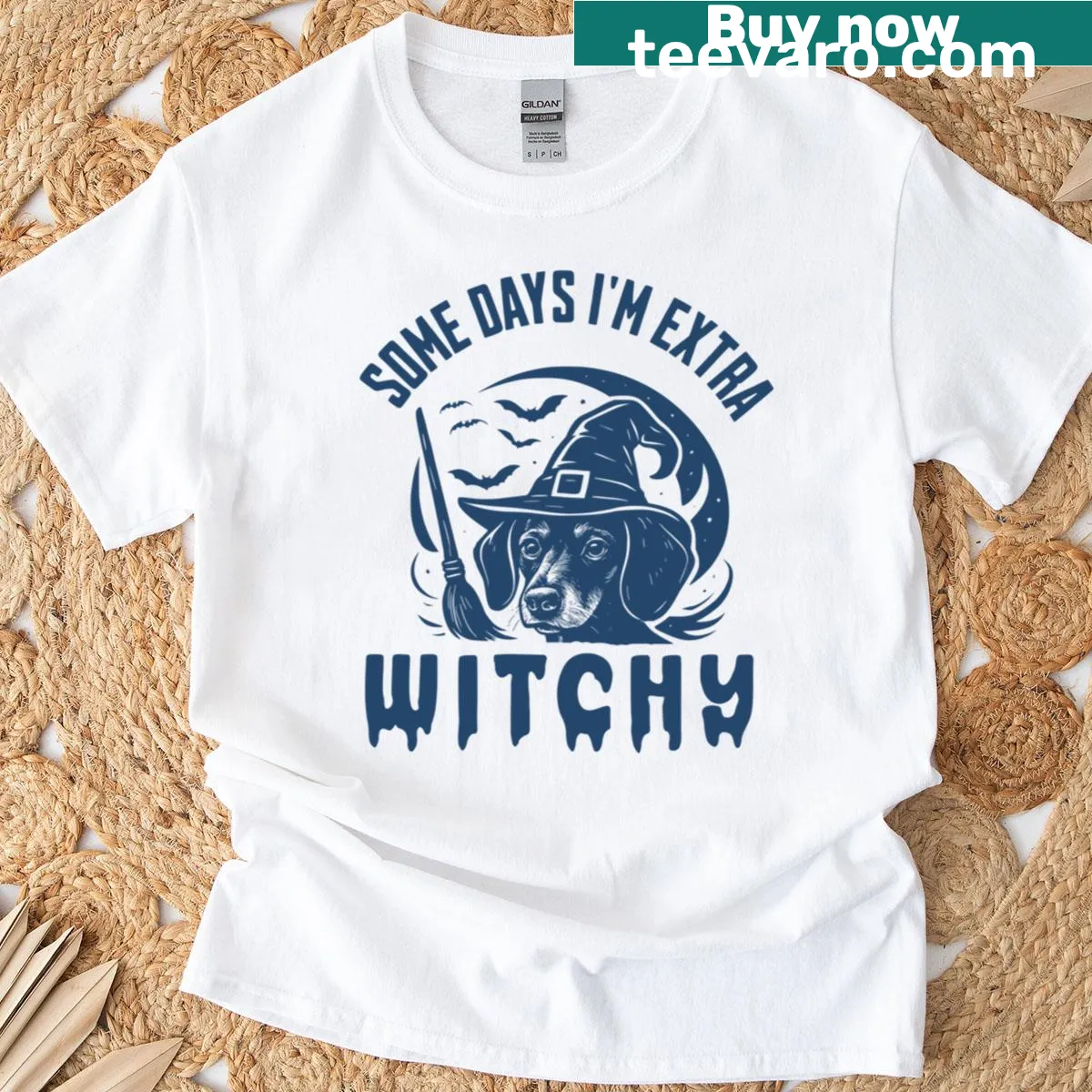Cartoon Dachshund wearing a witch hat with Halloween elements — on a men's t-shirt