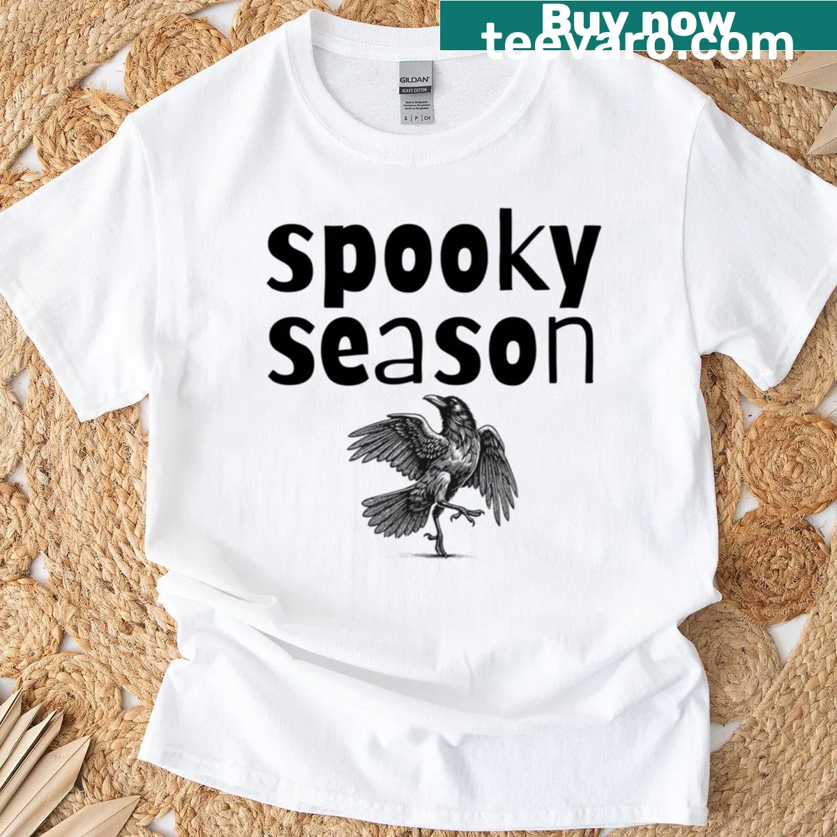 Whimsical crow graphic on an oversized spooky season t-shirt. — on a men's t-shirt
