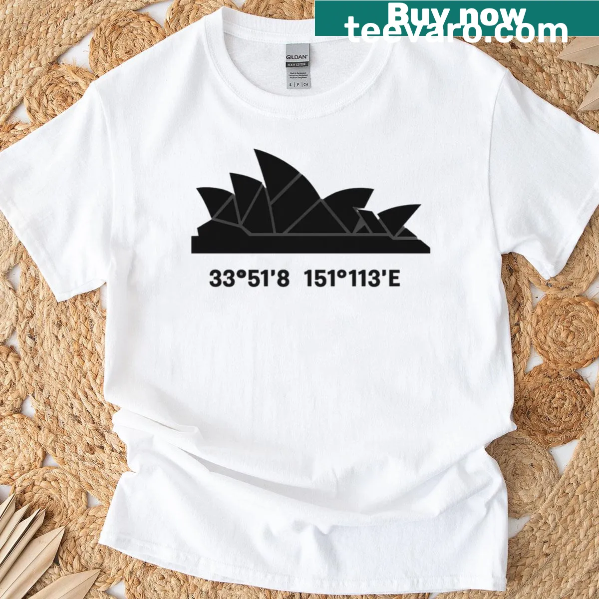 Minimalist Sydney Opera House tee with abstract geometric design and coordinates — on a men's t-shirt