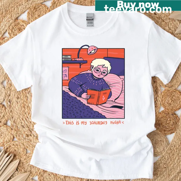 Cozy book lover t-shirt with a graphic of books and cozy elements