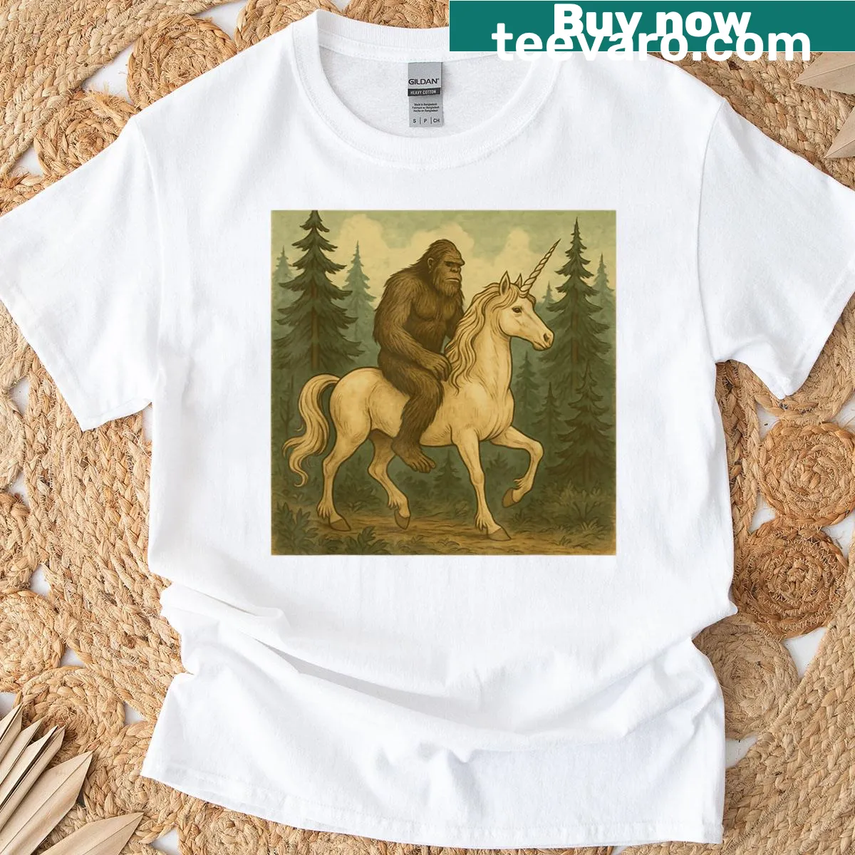 Cartoon of Bigfoot riding a unicorn — on a men's t-shirt