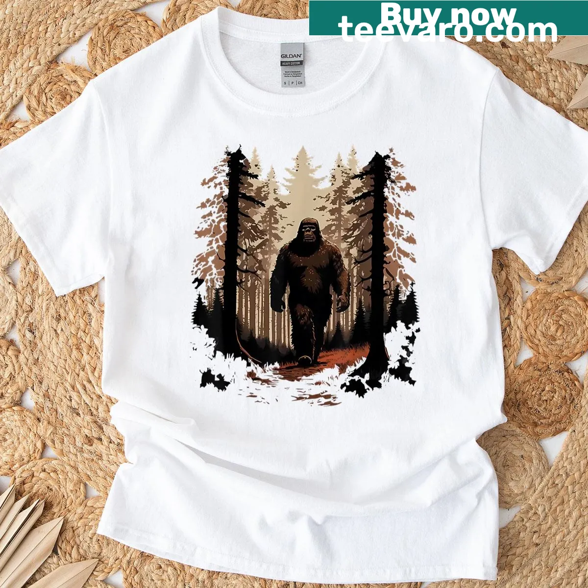 Whimsical graphic of Bigfoot in the forest on T-shirt — on a men's t-shirt