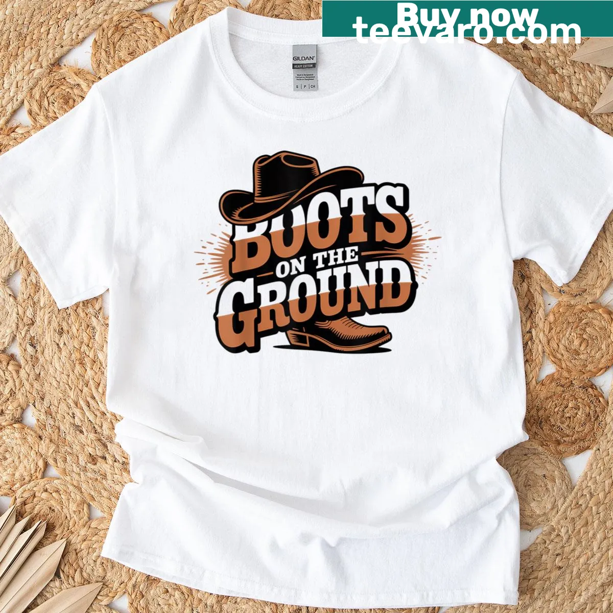 Western cowboy-style t-shirt with boots on the ground design — on a men's t-shirt
