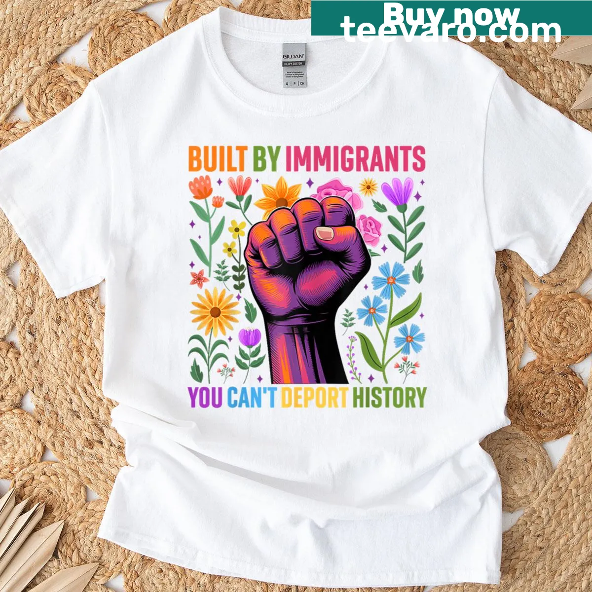 Floral design T-shirt with immigrant rights message — on a men's t-shirt