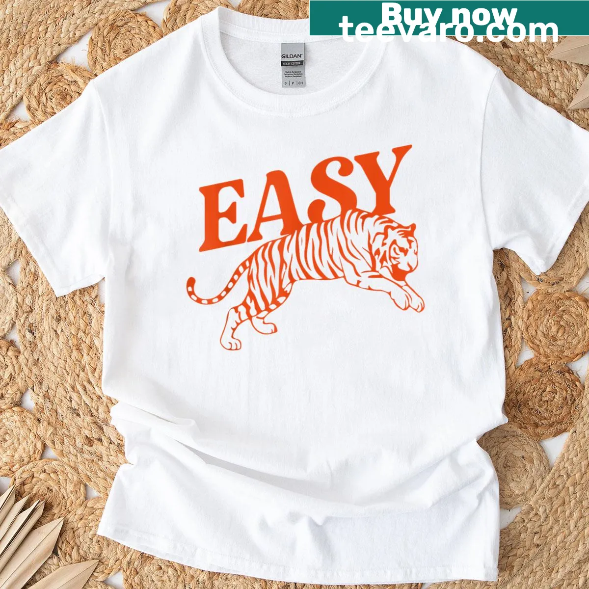 Distressed graphic T-shirt featuring a playful tiger design — on a men's t-shirt
