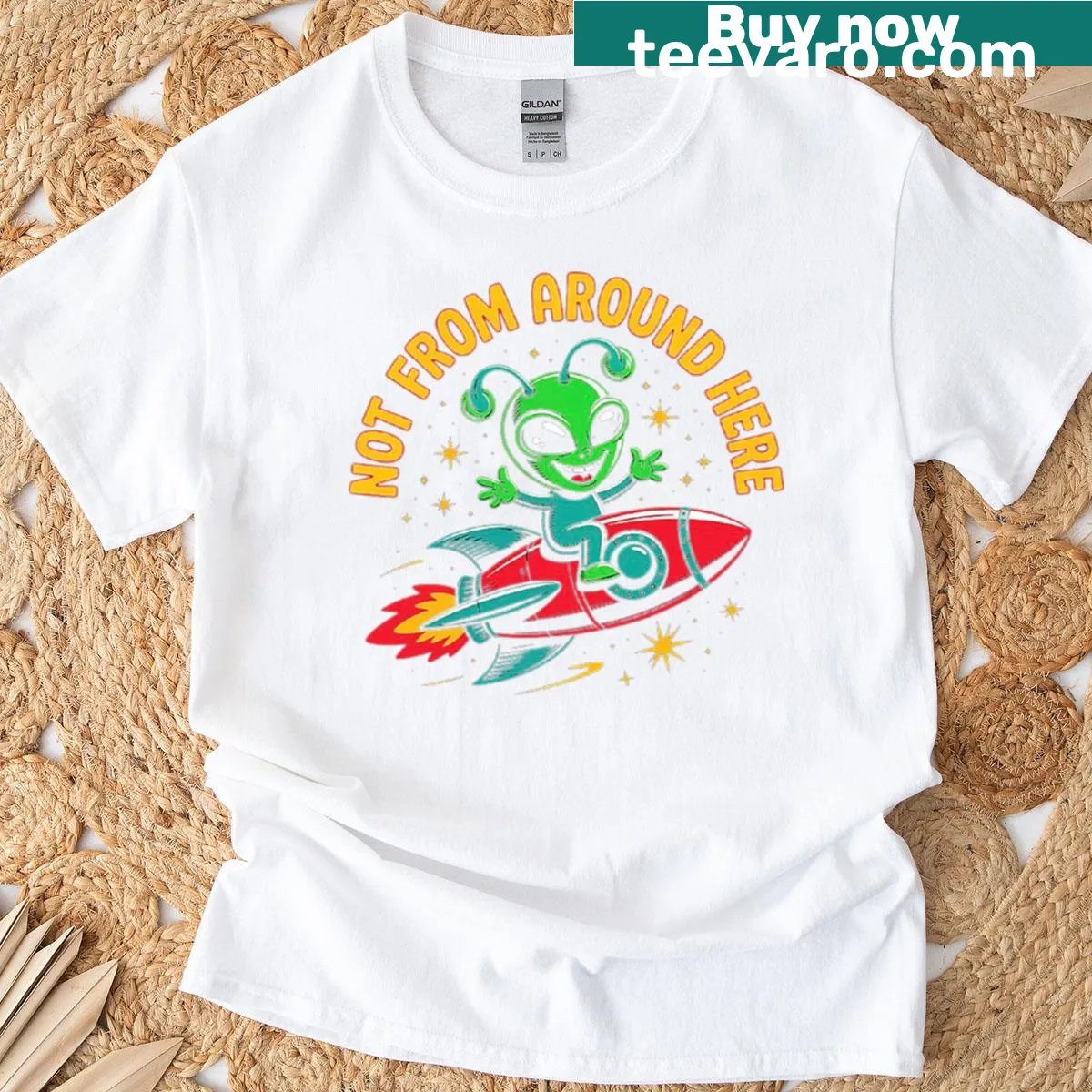 Playful cartoon alien on a rocket graphic on a T-shirt — on a men's t-shirt