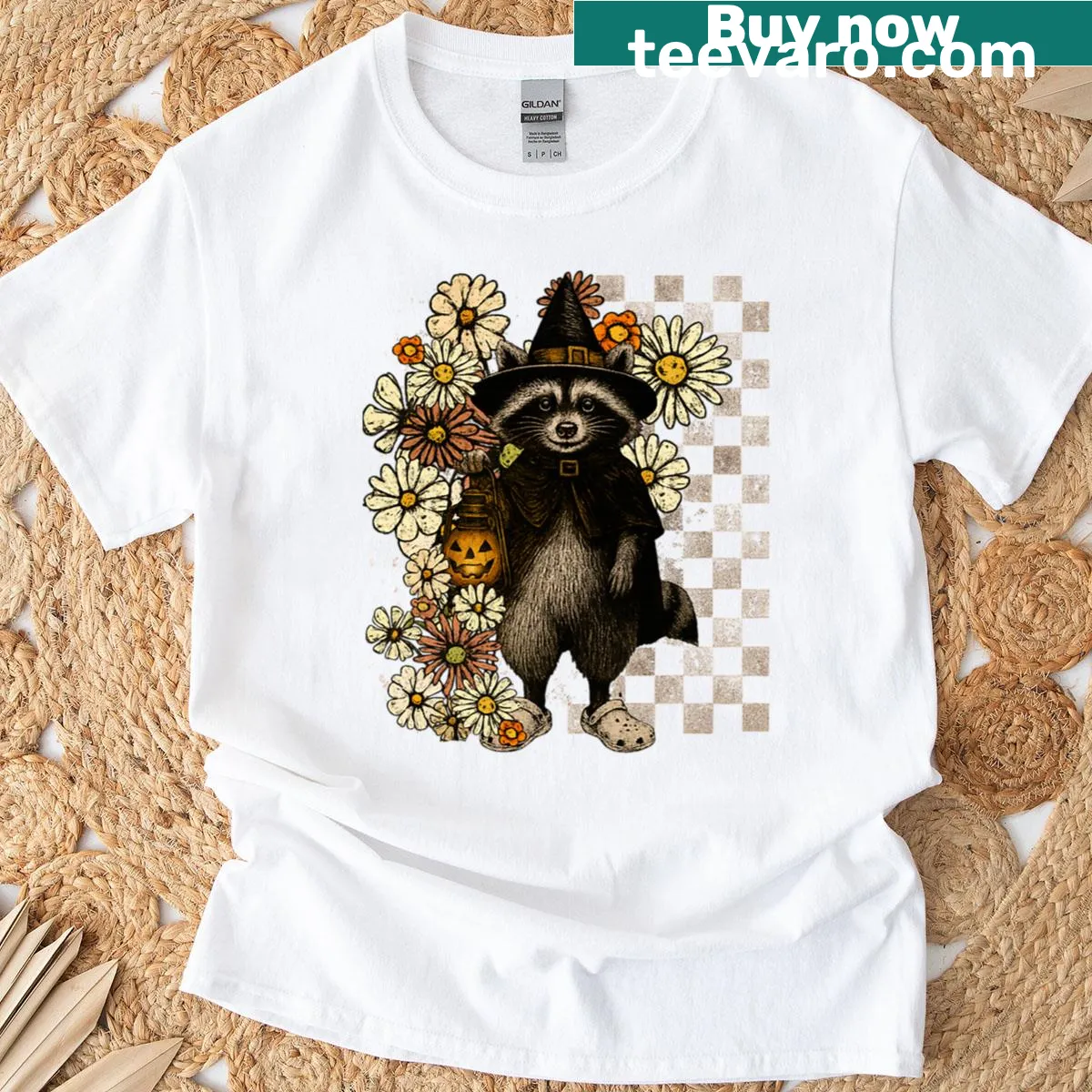 Cartoon Halloween T-shirt with raccoon, pumpkin, and flora — on a men's t-shirt
