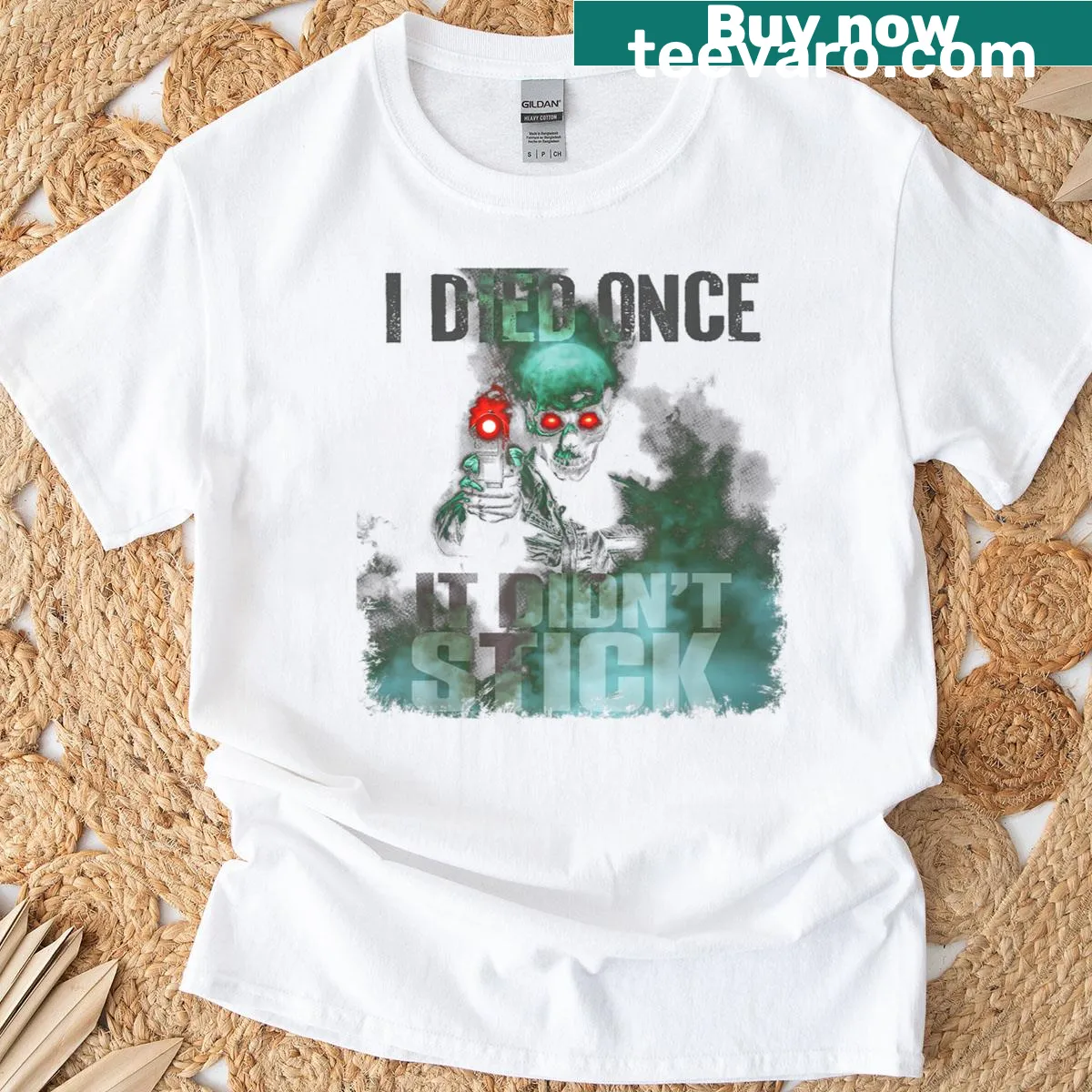 T-shirt with a zombie skeleton holding a smoke gun and humorous text — on a men's t-shirt