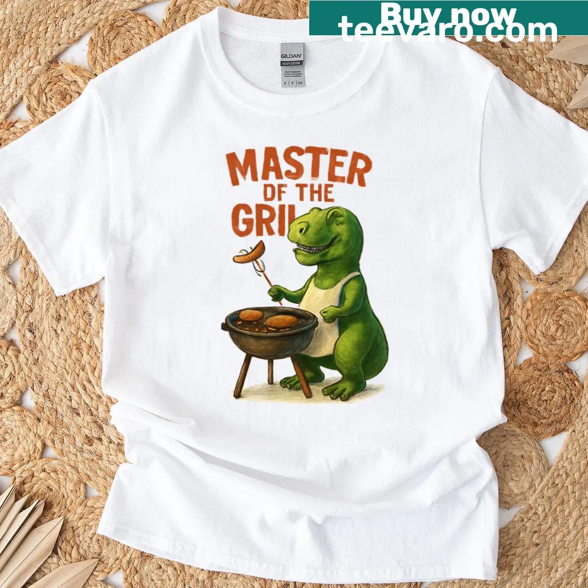 T-shirt featuring a dinosaur graphic and the text 'Master Of The Grill' — on a men's t-shirt