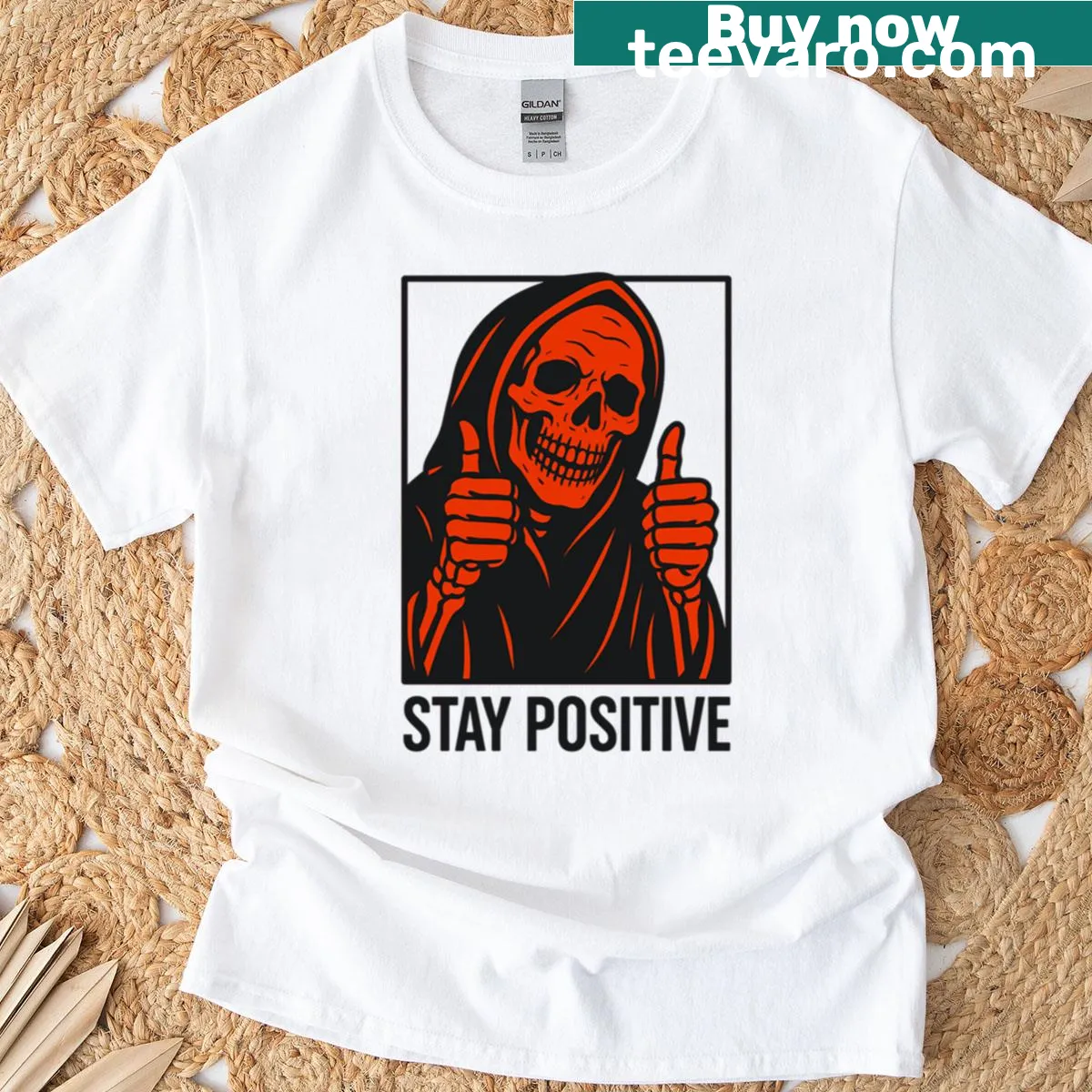 Oversized orange T-shirt with a friendly reaper and 'Stay Positive' text — on a men's t-shirt