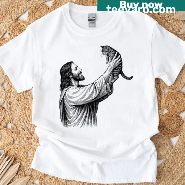 Vintage design of Jesus holding a cat on a distressed t-shirt.