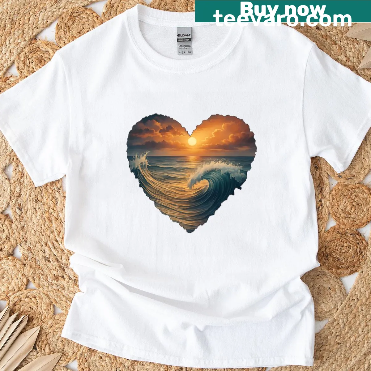 Heart-shaped ocean sunset t-shirt with waves and golden sky art — on a men's t-shirt