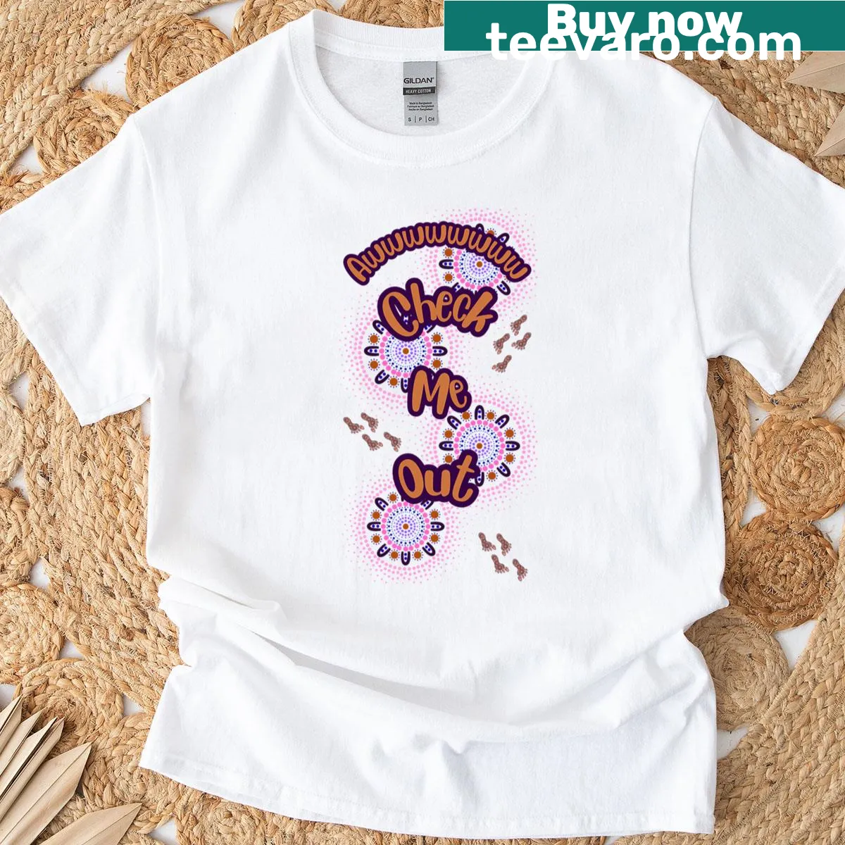 T-shirt featuring an Indigenous dot painting design and playful text — on a men's t-shirt