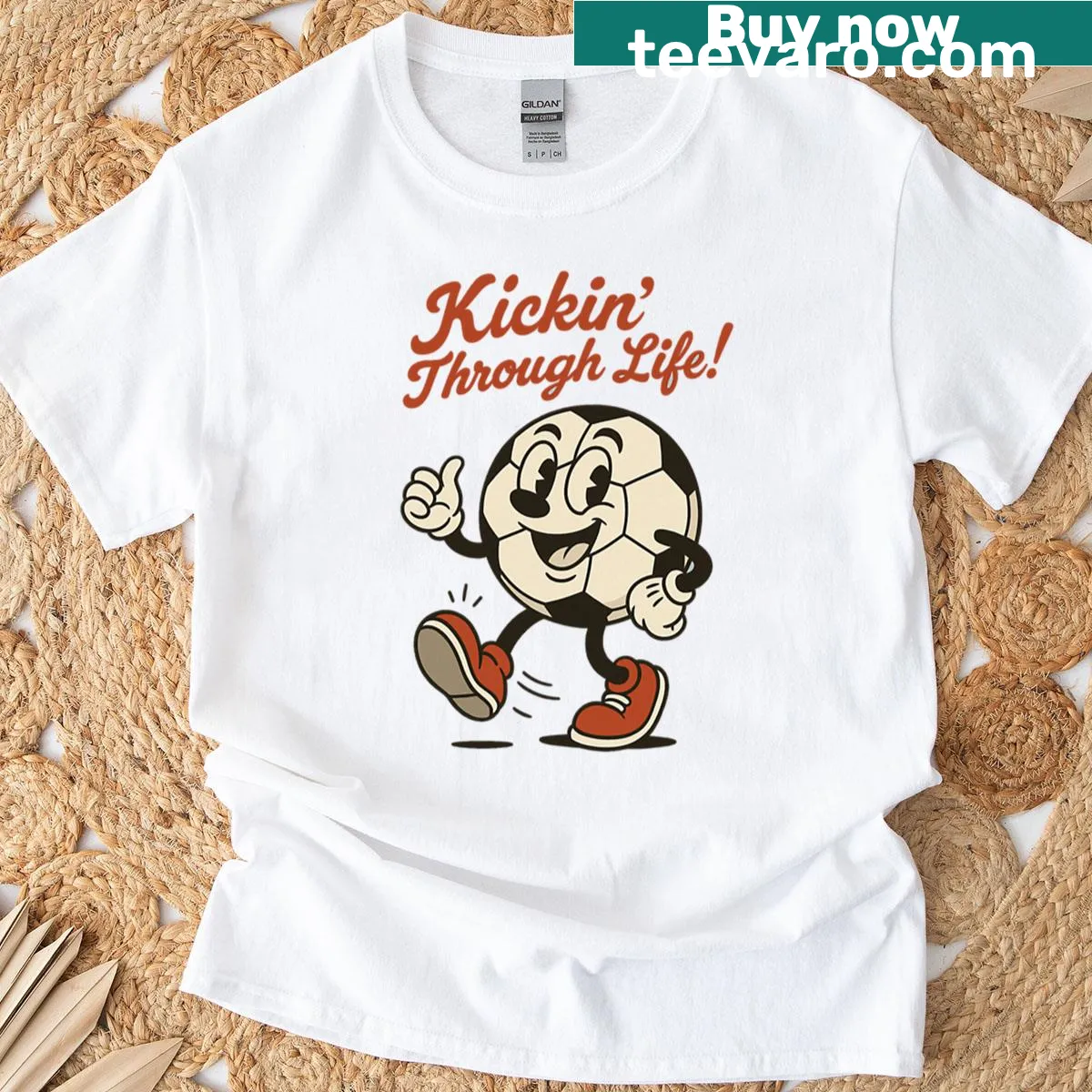 Cartoon T-shirt with soccer ball and the phrase 'Kickin Through Life'. — on a men's t-shirt