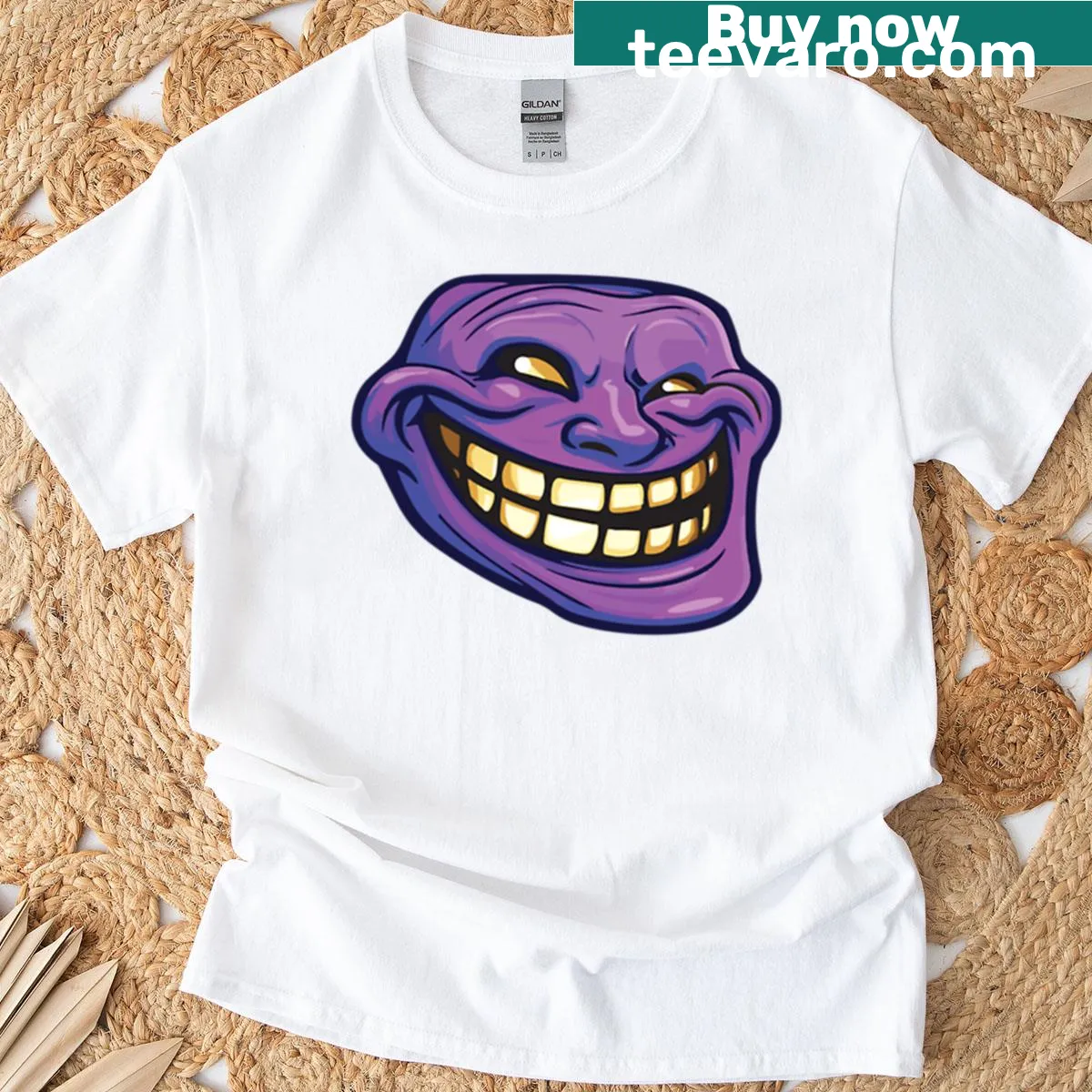 Illustration of a purple troll head with sinister grin and yellow teeth — on a men's t-shirt