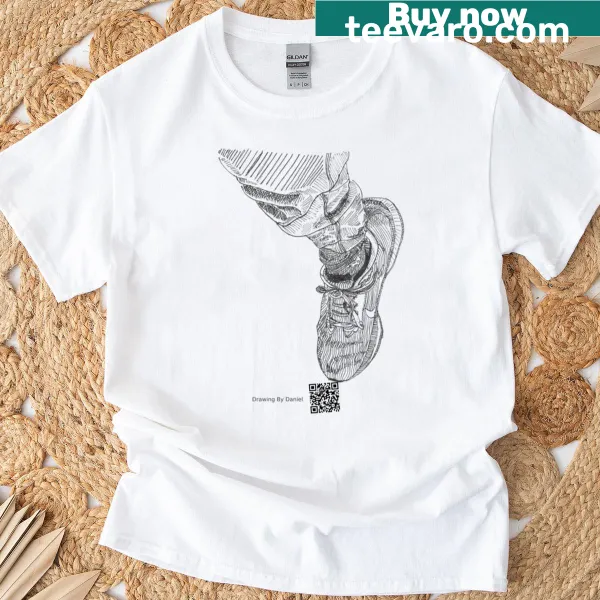 T-shirt featuring a whimsical graphic of a slipper and a ruler