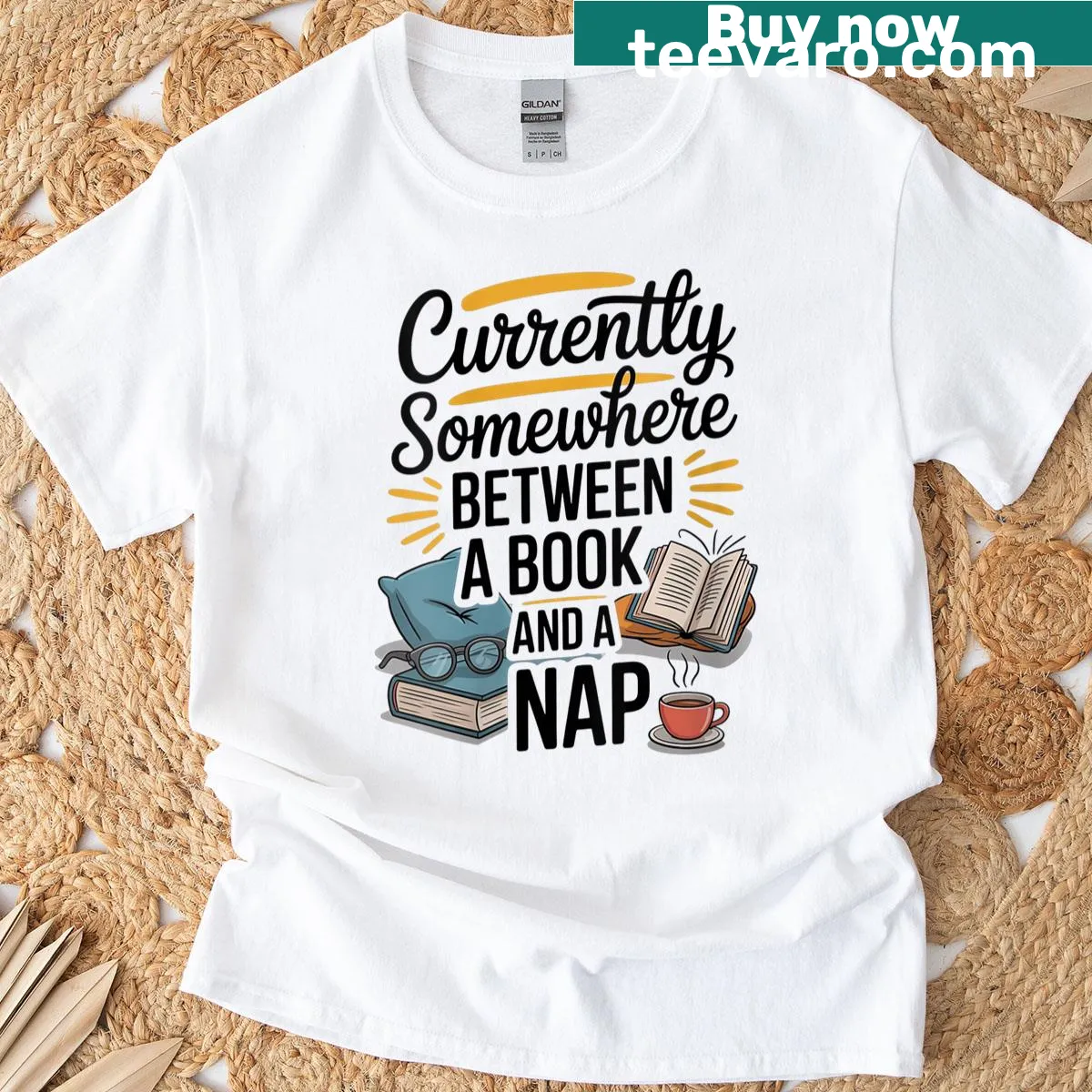 Cozy reading t-shirt with 'Somewhere Between A Book And A Nap' text — on a men's t-shirt