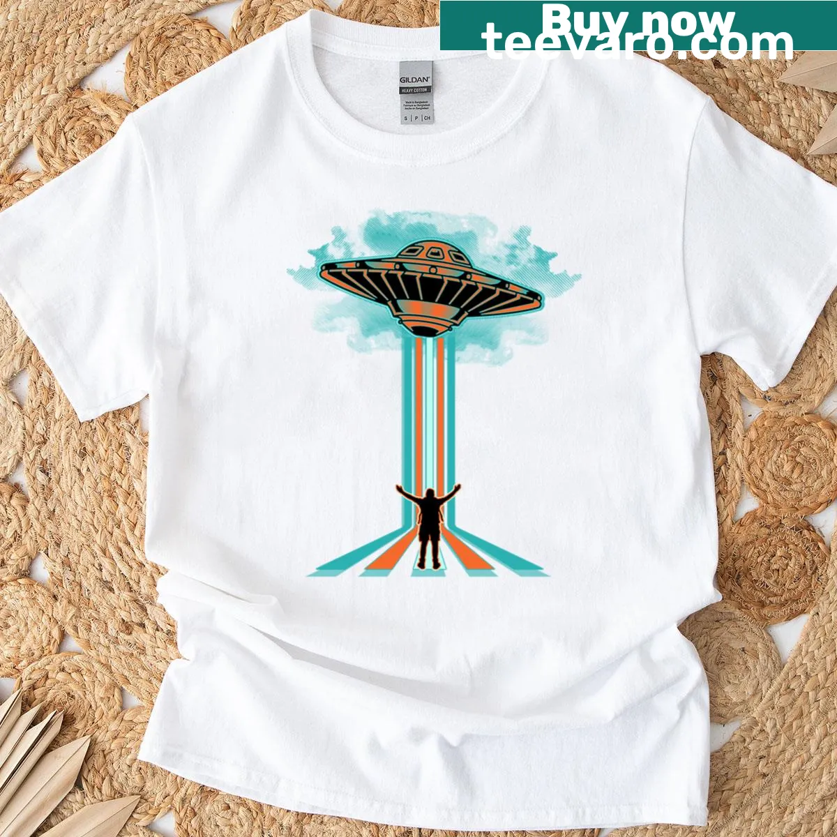 Oversized shirt featuring whimsical 'Born Among Aliens' illustration — on a men's t-shirt