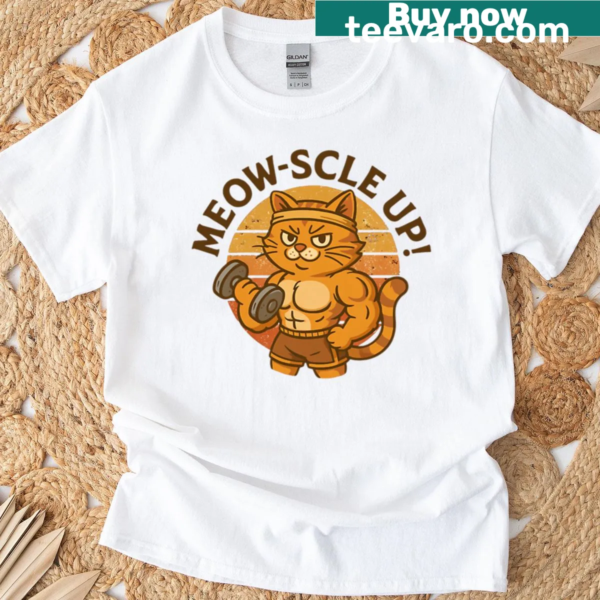 Funny buff cat gym t-shirt with 'Meow-scle Up' text — on a men's t-shirt