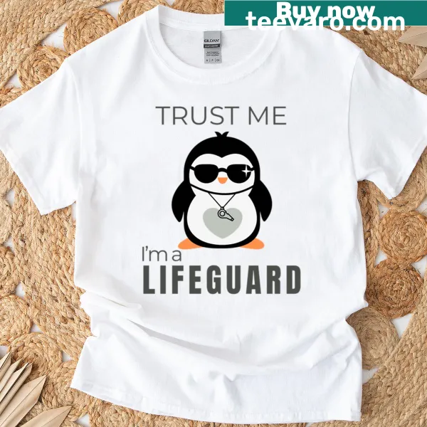 Funny penguin lifeguard t-shirt with playful tagline for beach lovers.