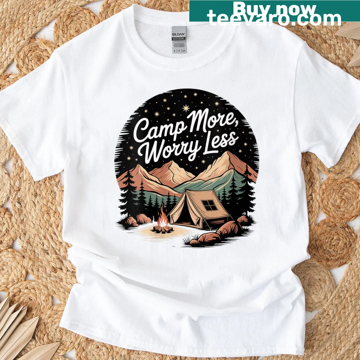 Minimalist women's t-shirt with outdoor camping graphic saying 'Camp More.' — on a men's t-shirt