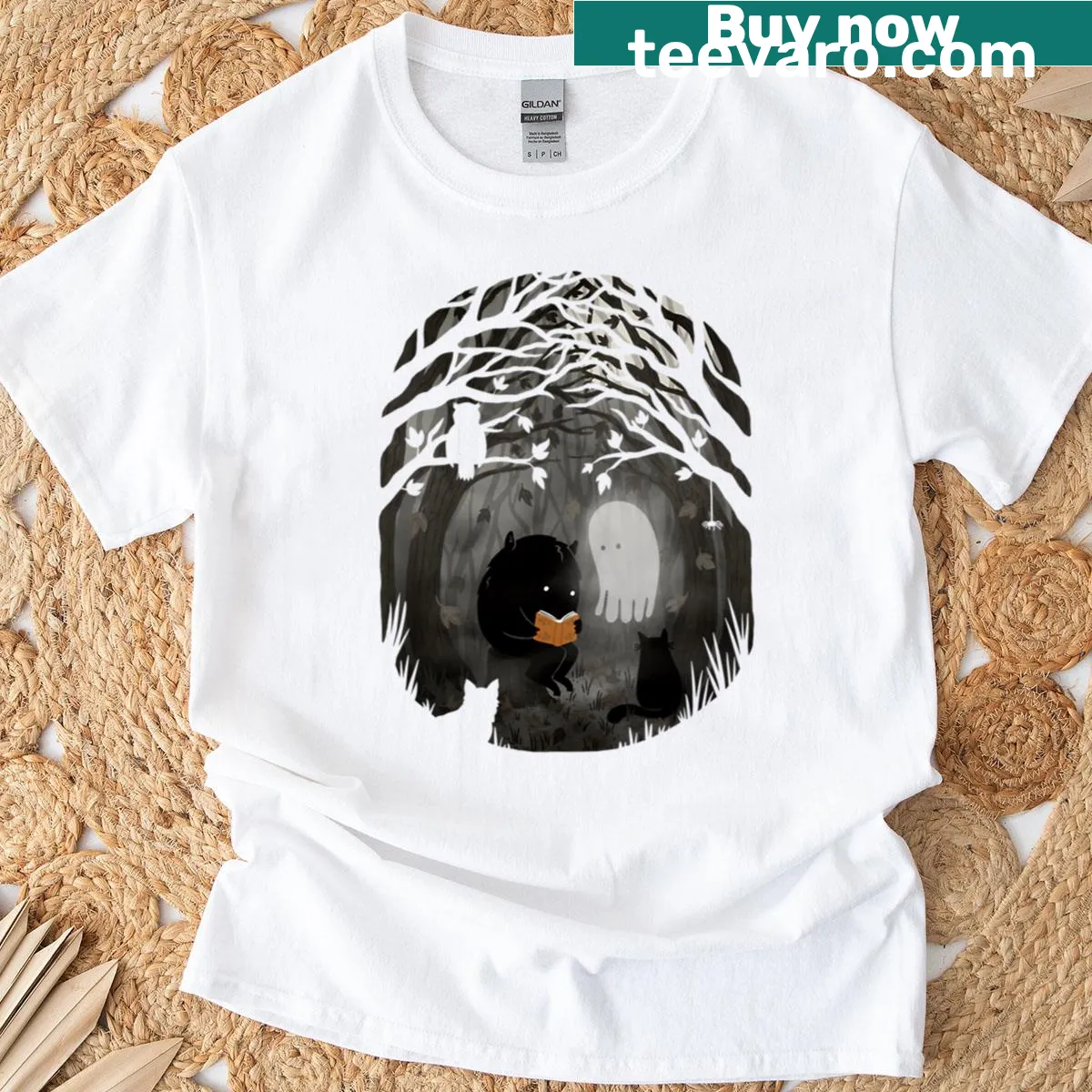 Cute monster reading a book graphic on a t-shirt — on a men's t-shirt