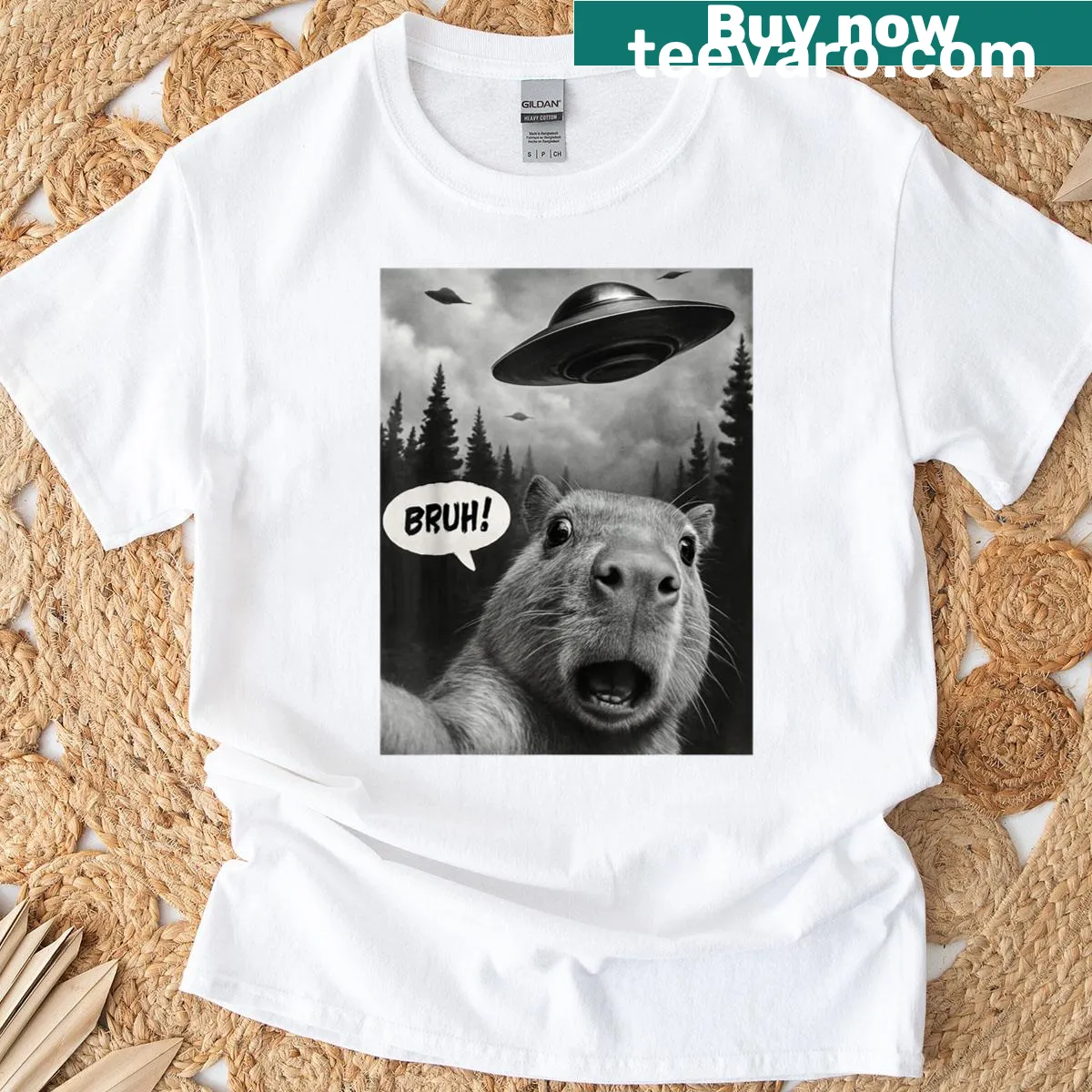 Capybara taking a selfie with UFOs in a whimsical graphic on a t-shirt — on a men's t-shirt