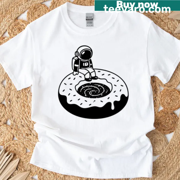 Cartoon astronaut relaxing on a donut in space on a T-shirt