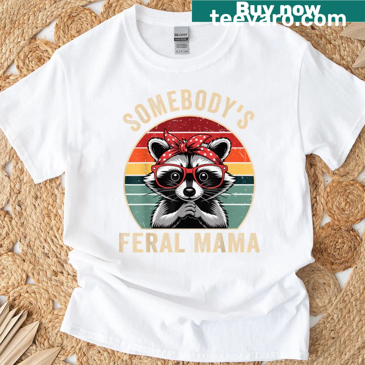 Funny T-shirt featuring an illustration of a raccoon with the phrase 'Somebody's Feral Mama' — on a men's t-shirt