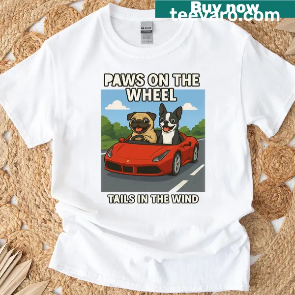 Oversized t-shirt with a graphic of paws on a wheel and tails in the wind.