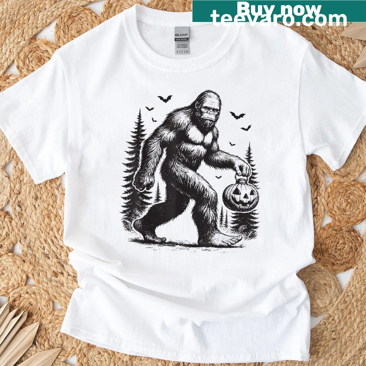Cartoon Bigfoot emerging from a pumpkin on a Halloween t-shirt — on a men's t-shirt