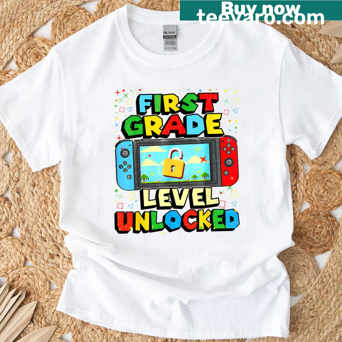 Funny gamer t-shirt for boys with '1st Grade Level Unlocked' text — on a men's t-shirt