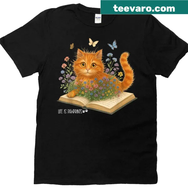 Cute graphic t-shirt featuring a cat, wildflowers, and books