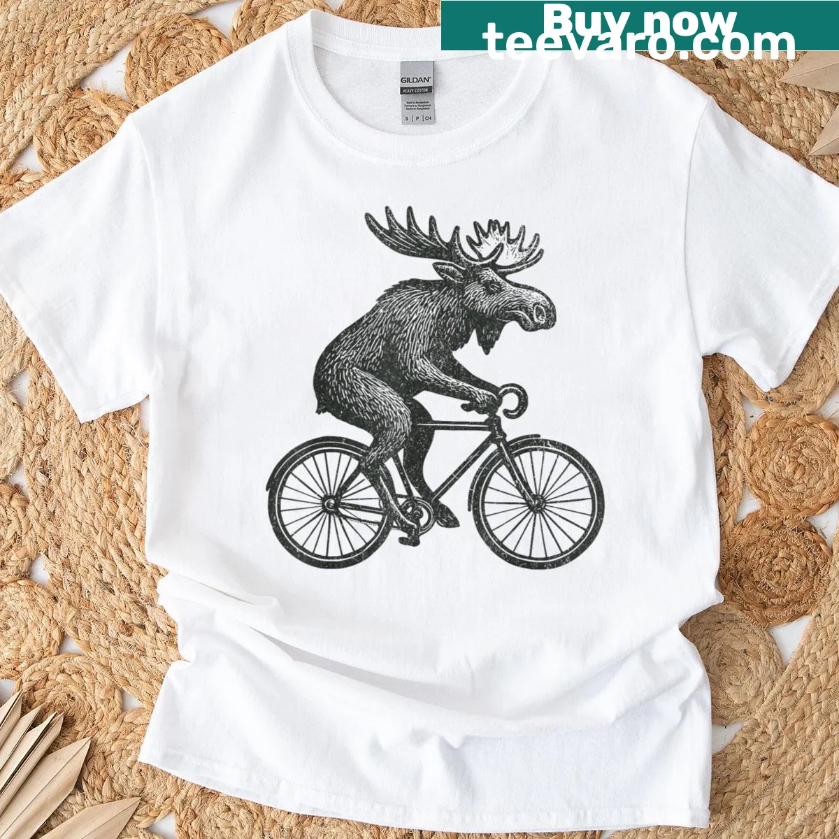 Whimsical T-shirt featuring a moose riding a bicycle — on a men's t-shirt