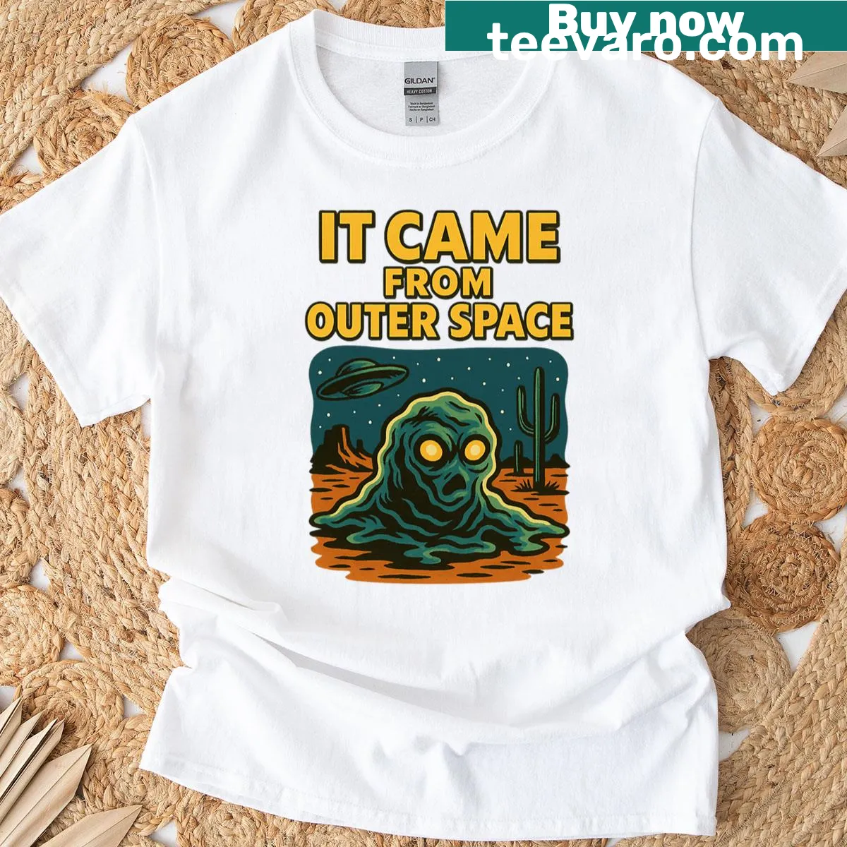 Whimsical alien booger design on an oversized t-shirt — on a men's t-shirt