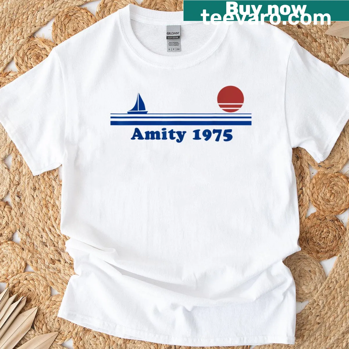 Illustrative T-shirt featuring a sailboat at sunset over the ocean. — on a men's t-shirt