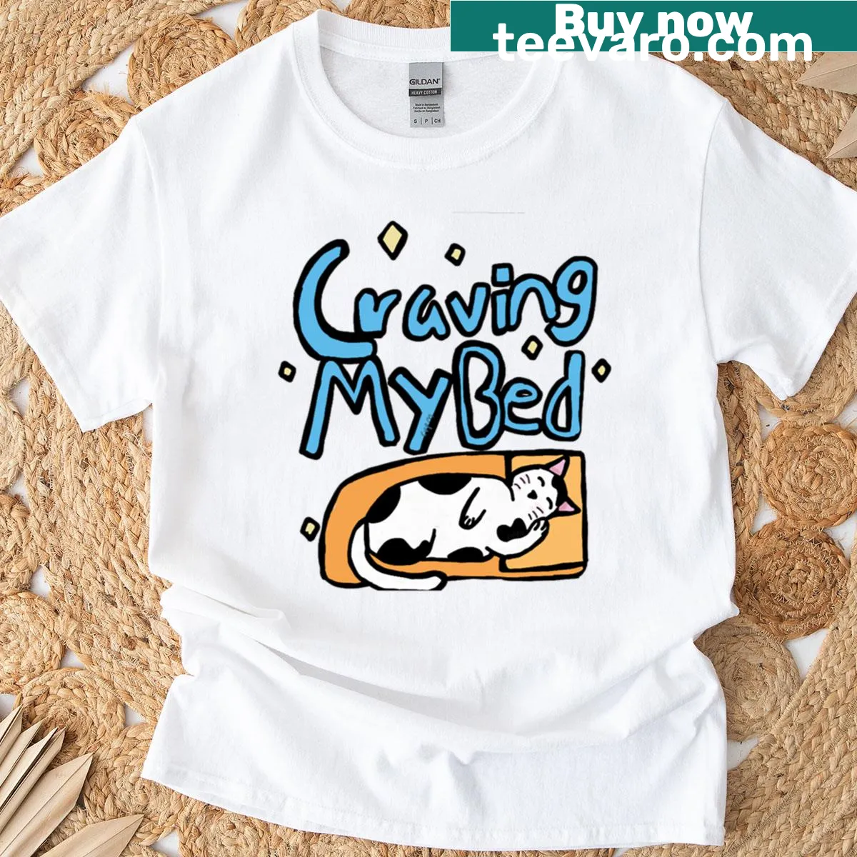 Illustration of a sleepy black and white cat with a text design — on a men's t-shirt