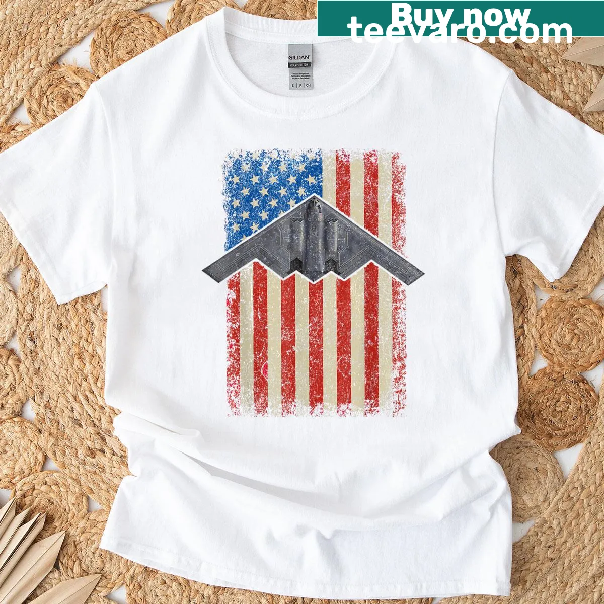 T-shirt featuring graphic of B-2 stealth bomber aircraft — on a men's t-shirt
