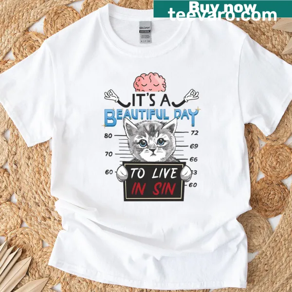 Whimsical oversized T-shirt celebrating cats and a carefree lifestyle.