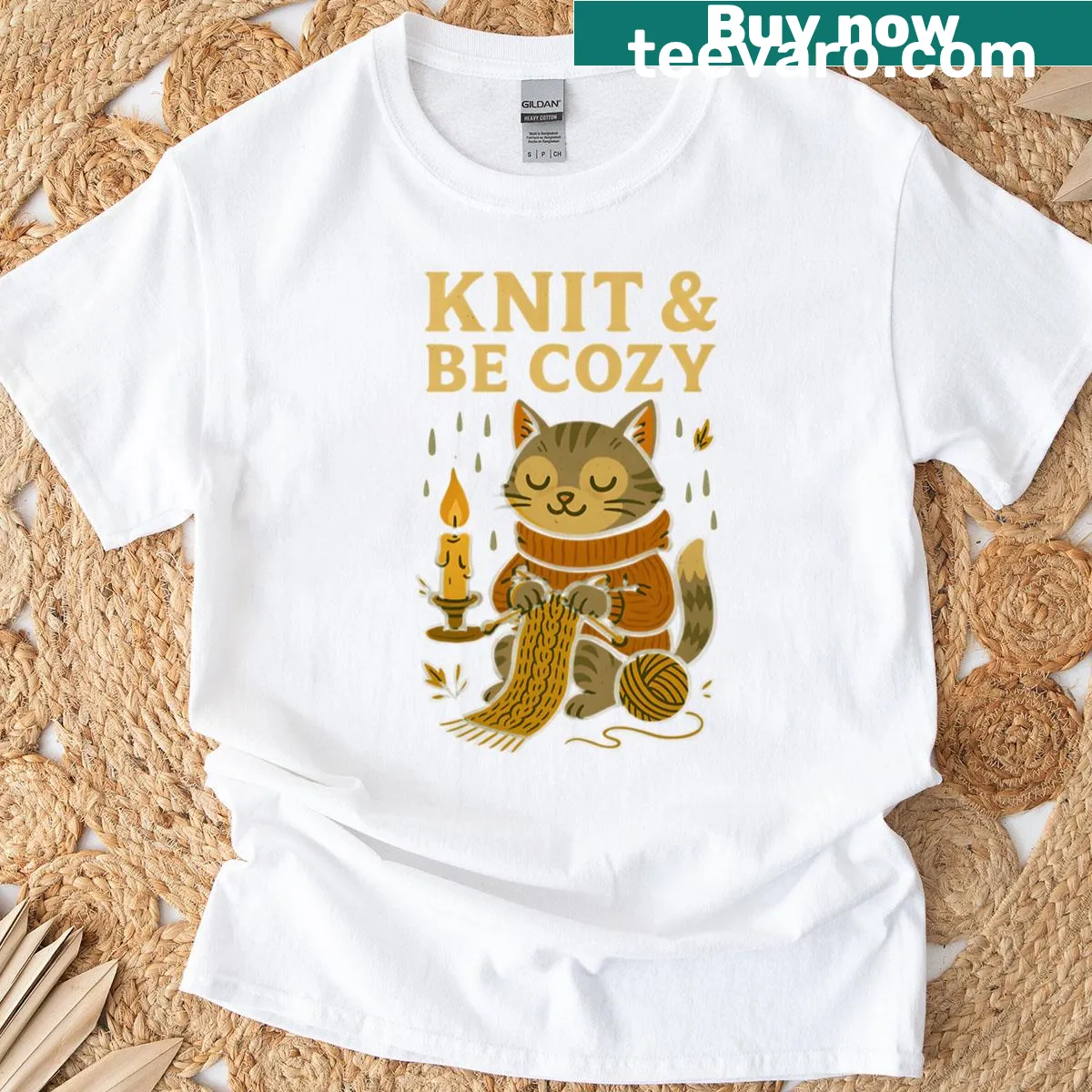Cute illustration of a cat with knitting supplies and candlelight — on a men's t-shirt
