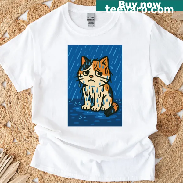 T-shirt featuring a calico cat sitting in the rain, conveying emotion.