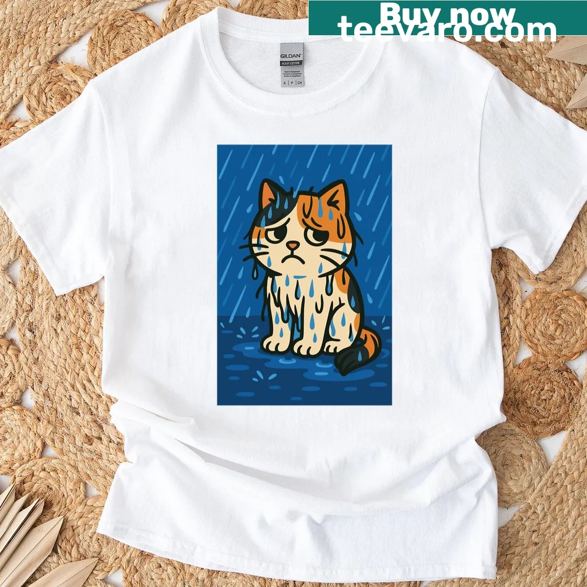 T-shirt featuring a calico cat sitting in the rain, conveying emotion. — on a men's t-shirt