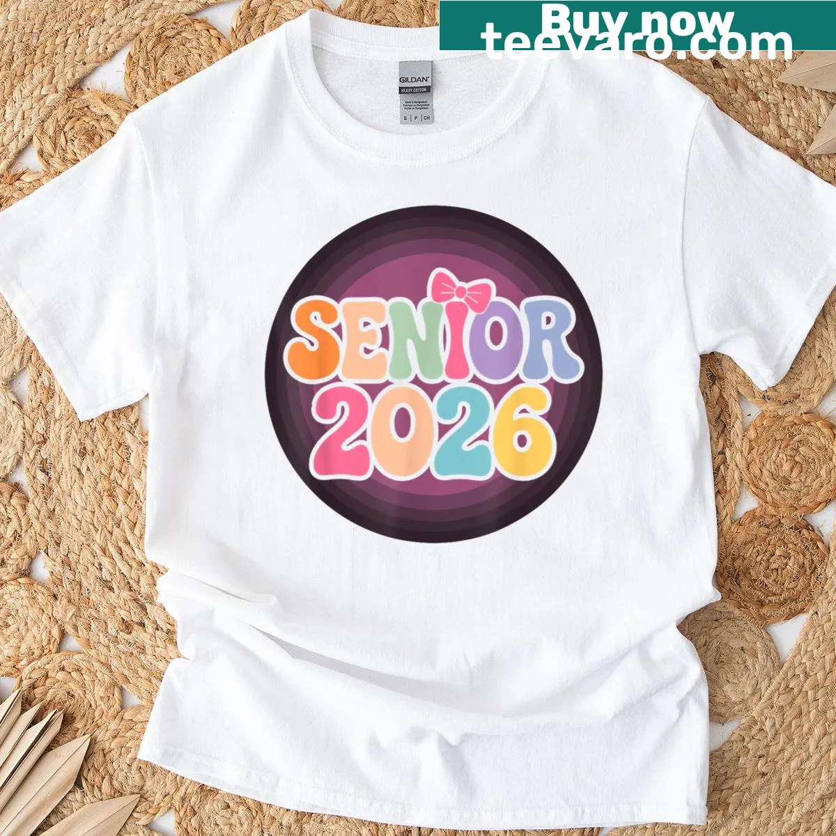 Playful Senior 2026 T-shirt with groovy pink coquette bow graphic — on a men's t-shirt