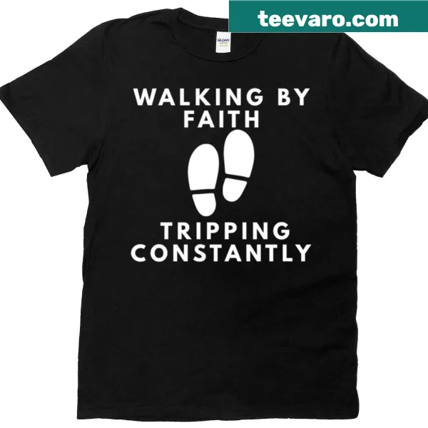 Inspirational T-shirt with the phrase 'Walking By Faith Tripping Constantly' in stylish typography.