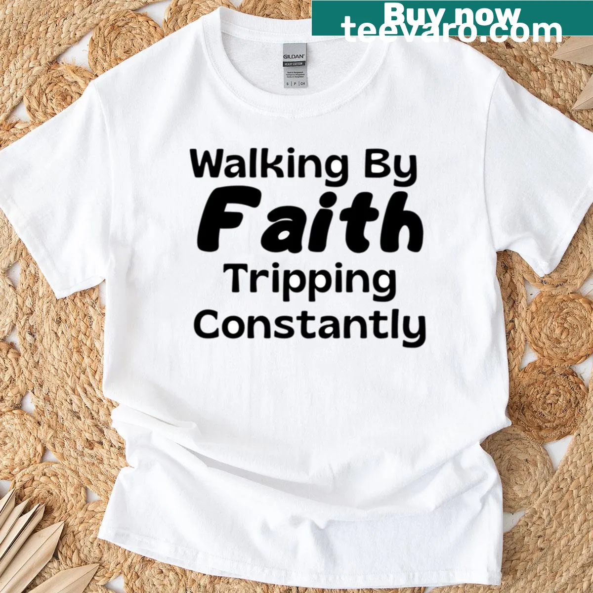 Funny Christian T-shirt with 'Walking By Faith Tripping Constantly' text — on a men's t-shirt