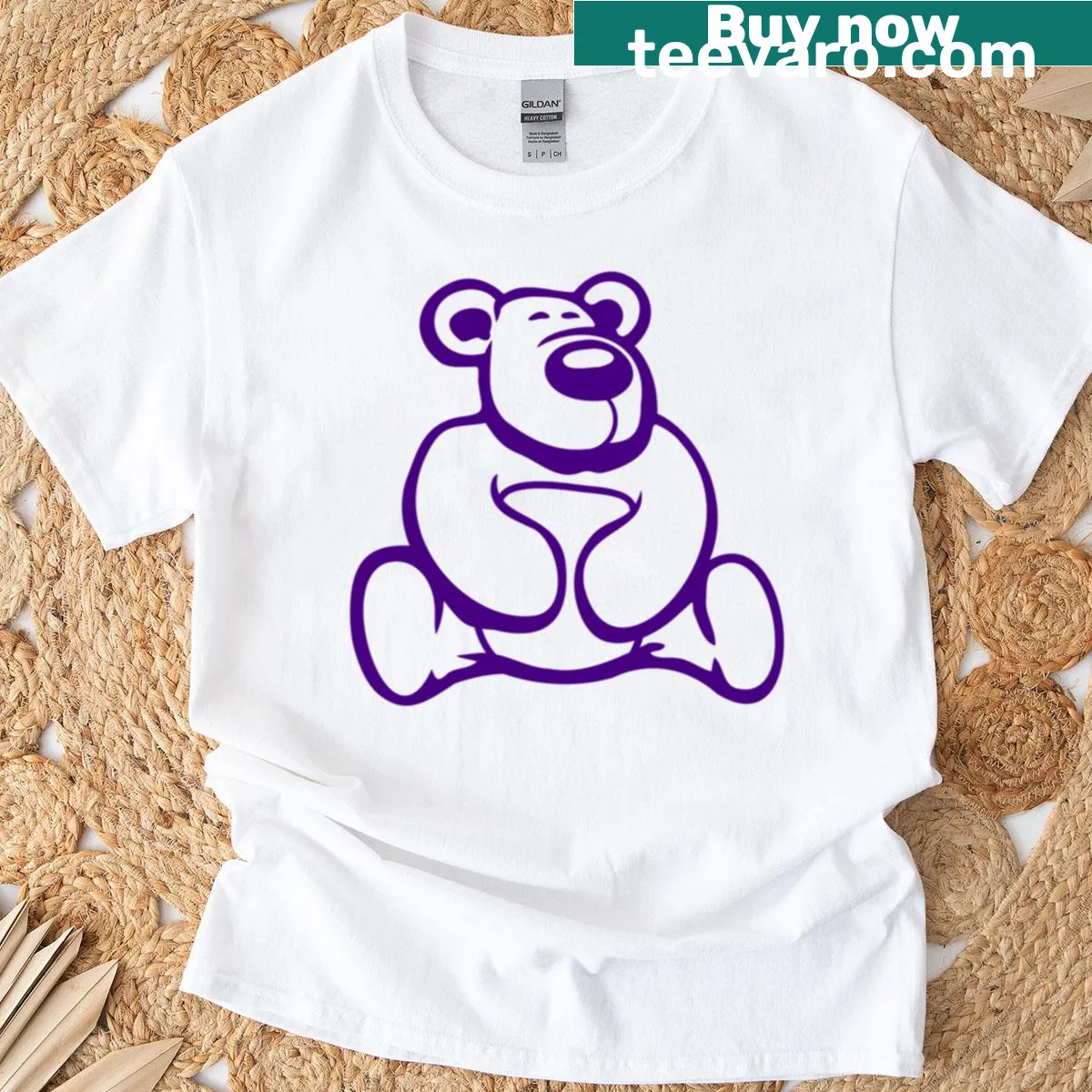 Cute illustration of a friendly teddy bear with a big nose sitting down — on a men's t-shirt