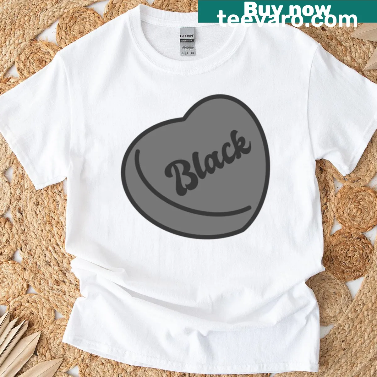 Playful graphic t-shirt featuring a black candy heart — on a men's t-shirt