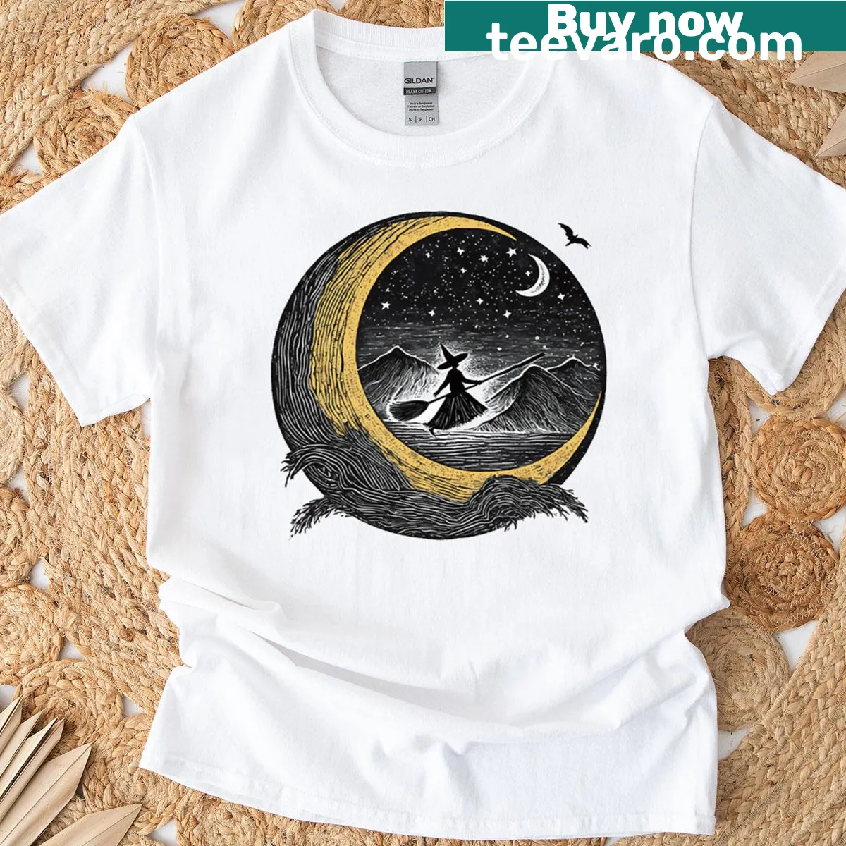 Whimsical witch theme T-shirt with brooms and spellbooks under a crescent moon. — on a men's t-shirt