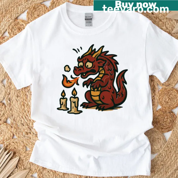 Cartoon t-shirt featuring a funny dragon trying to light candles.